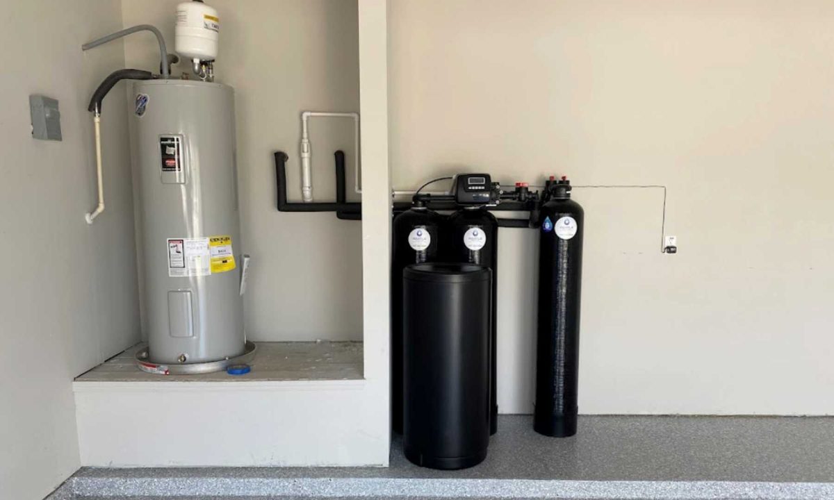 Electric water heater beside softener and filter tanks